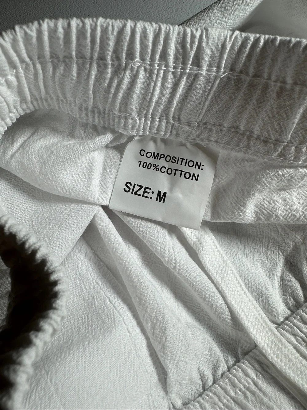 2 pack of Women's lightweight pants. One white and one black pair of medium pant
